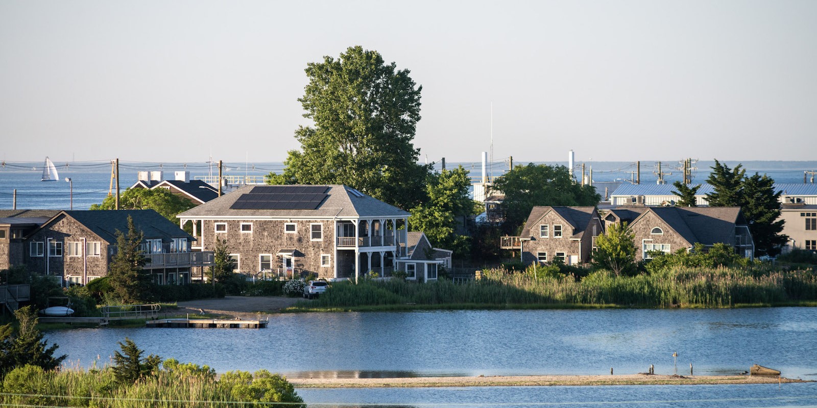 A cropped version of the Falmouth Enterprise logo over a map of Cape Cod with the Upper Cape towns of Falmouth, Bourne, Mashpee, and Sandwich highlighted